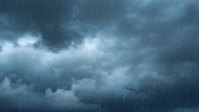 激しい雨が降る暗い空の雲背景ドラマチック天候イメージ