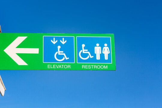 ADA Access and regular restrooms sign on a Puget Sound ferry, Seattle, WA USA