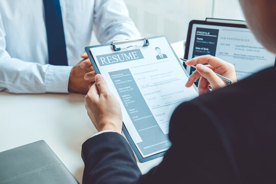 Job interview concept , Senior manager reading a resume during a job interview employee young man meeting Applicant and recruitment