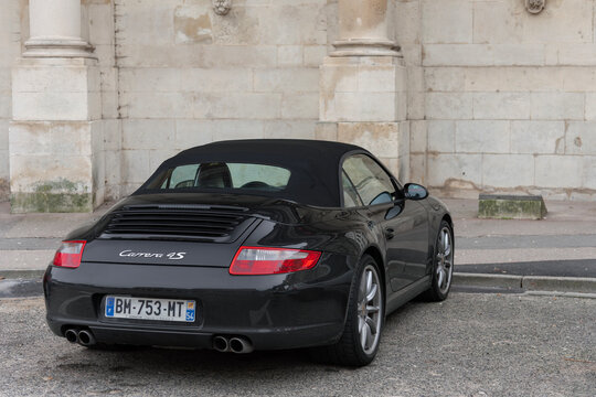 Nancy, France - January 3rd 2019 : View on a black Porsche 997 Carrera 4S Cabriolet parked on the street.