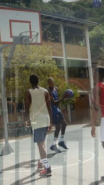 Vertical video: Tank player at key as blue driving ball, red scoring, bars obscuring school court