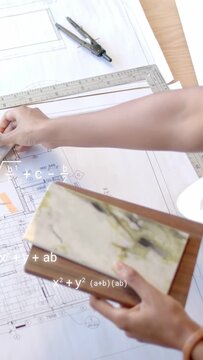 Vertical video: Designer holding wood tile over plan, aligning with ruler, math overlays appearing