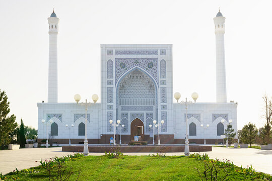 Minor mosque in Tashkent with white marble facade and twin minar