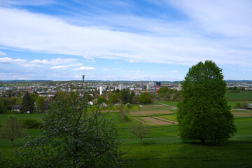 Fototapeta premium Scenic view over Glatt Valley seen from viewpoint at Swiss city of Zürich district of Schwamendingen on a sunny spring day. Photo taken April 20th, 2026, Zurich Schwamendingen, Switzerland.