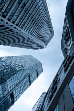 Urban Frankfurt Bankenviertel corporate business finance skyline feel with modern office skyscraper architecture rising in strong perspective above the city