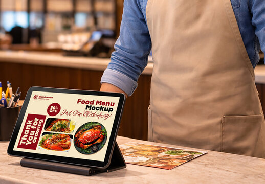 Tablet Menu Mockup on Restaurant Counter with Food Display