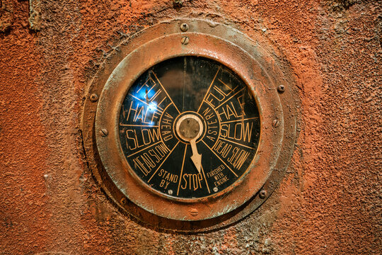 Vintage ship engine telegraph dial close-up, nautical control instrument