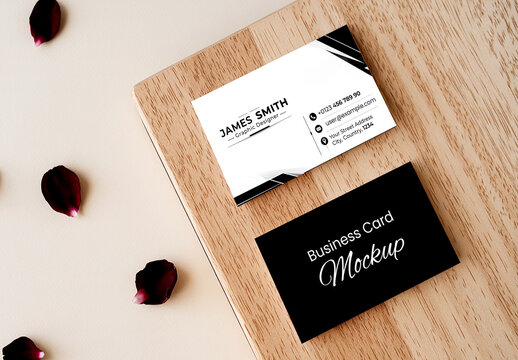 Two Business Card Mockups on Wooden Block with Red Rose Petals on Neutral Background