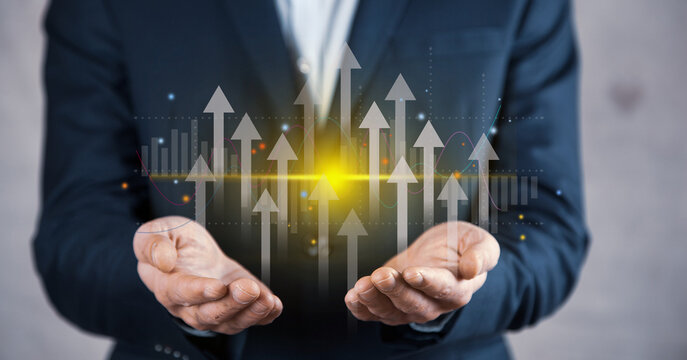 Growth planning and business strategy. Businessman holding financial growth chart increased income. market statistics gain profits.