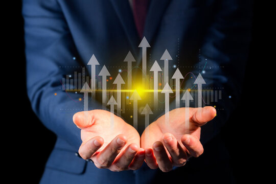 Growth planning and business strategy. Businessman holding financial growth chart increased income. market statistics gain profits.