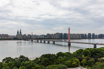 Fototapeta premium Hangzhou Qianjiang Third Bridge and modern skyline over the river