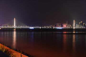 Fototapeta premium Hangzhou Qianjiang Third Bridge at Night Over the Qiantang River