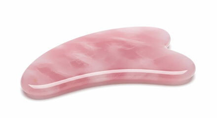 Fototapeta premium A smooth pink rose quartz gua sha facial massage tool on a white background.
