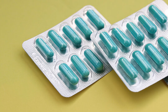 Blue capsules of Doxycycline in blister packs.