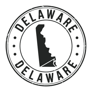 A distressed stamp featuring the state of delaware and its name