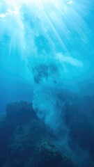 Obraz premium Sunlight Beams Through Ocean Water Creating Beautiful Underwater Light Rays.