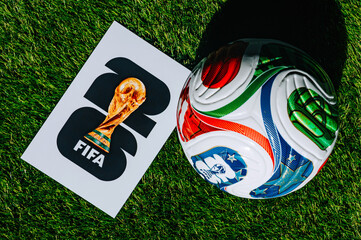 Fototapeta premium Official FIFA World Cup 2026 Match Ball on Pitch and official logo of soccer tournament in USA, Canada and Mexico