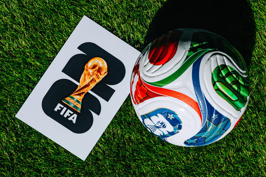 Official FIFA World Cup 2026 Match Ball on Pitch and official logo of soccer tournament in USA, Canada and Mexico
