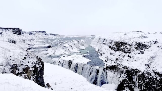 Majestic frozen Gullfoss waterfall close-up view during winter. High quality FullHD footage