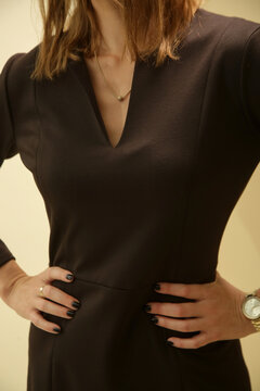 Studio Fashion Portrait of Woman in Tailored Brown Midi Dress with Long Sleeves &ndash; Business Style