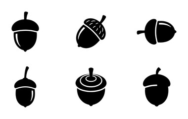Minimalist acorn icon set, black silhouette oak nut symbols, collection of 6 forest seed vector illustrations for autumn branding and nature logos © Touhidul