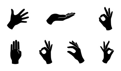 Obraz premium Black hand silhouettes collection, set of 7 human hand gestures and palm icons, minimalist finger signs and communication symbols for UI design