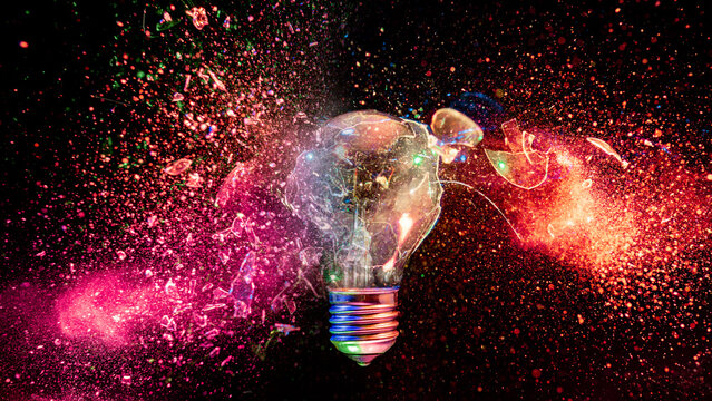 real Light bulb exploding creating colorful glass fragments
