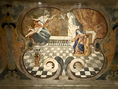 CAPUA, ITALY - NOV 2025: Detailed marble inlay depicting the Annunciation scene on the high altar of the Church of Saint Mary of the Announcement in Capua.