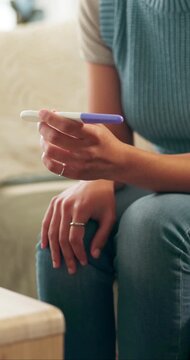 Stress, pregnancy test and hands of woman on sofa in home with regret, upset or mistake for unplanned maternity. Anxiety, scared and female person with positive result for failed birth control.
