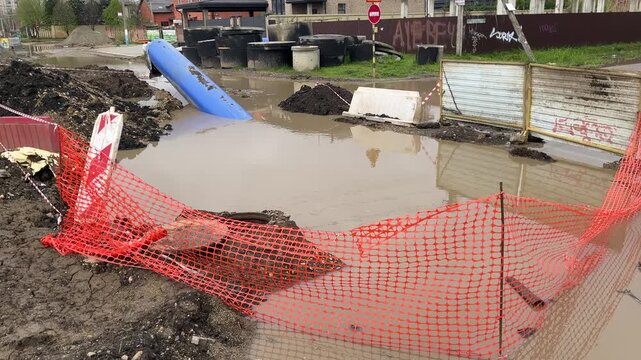 Consequences of heavy rain: storm water has flooded roads and ground in the residential district, because of storm sewer malpractice. Engineers have failed design of rainwater disposal