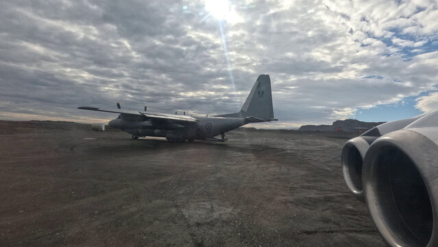 A Peruvian Air Force (FAP) Lockheed KC-130H Hercules transport aircraft on the gravel runway of King George Island during the 2026 ANTAR scientific expedition mission