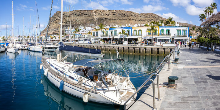 Sailing boats in Puerto de Mogan port harbor on Gran Canaria island on Canary Islands panorama holiday in Spain