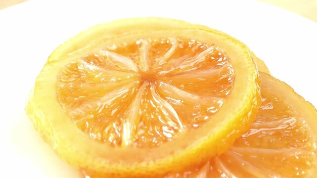 Sliced ​​lemons pickled in honey.
