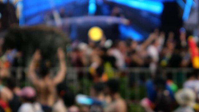 
Crowds enjoying Electronic Dance Music during Songkran Festival. Locals and tourists play with water and use water guns to celebrate the Songkran Festival in Bangkok. 