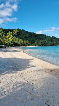 Vertical View, Empty Beach on Bora Bora Island, French Polynesia. White Sand, Turquoise Sea and Tropical Lush