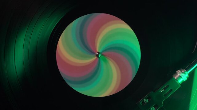 Spinning Vinyl Record With Rainbow Sticker, Top Down Close Up View