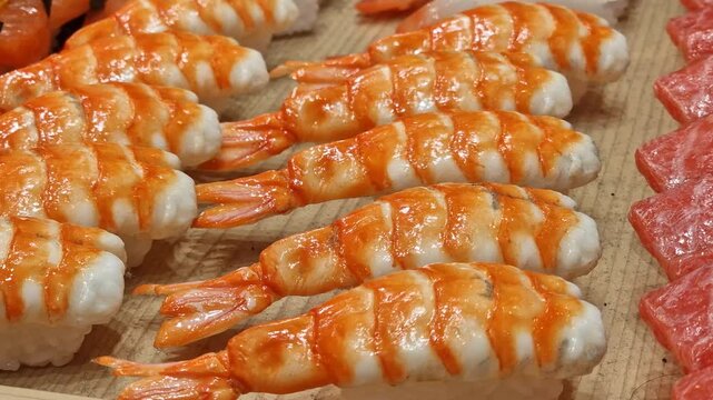 Ebi Nigiri and Aburi Wagyu Sushi at Display, Raw Japanese Shrimps and Beef Over Rice, Close Up