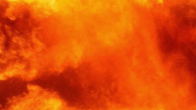 Intense raging fire blaze with glowing sparks and orange flames for abstract heat background