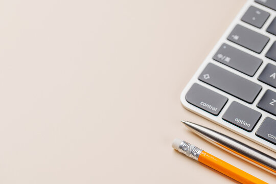 Office supplies on beige desk