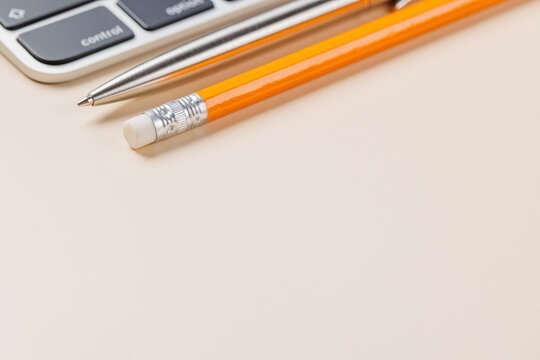 Office supplies on beige desk