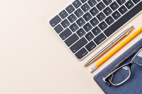 Office supplies on beige desk