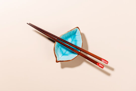 Minimal Chopsticks on Beige Background with Copy Space