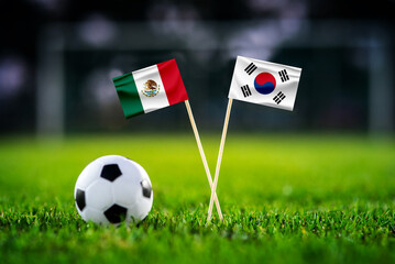 Obraz premium Mexico vs South Korea, national flags before world championship Group A group stage match, football on green pitch with goal in the background, Zapopan, Mexico, June 18, 2026