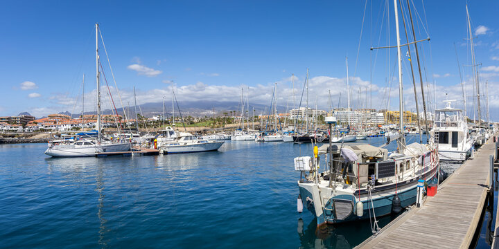 Sailboats in marina on Tenerife island vacation panorama in San Miguel de Abona, Spain