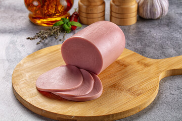 Boiled pork pink sausages with slices © Andrei Starostin
