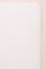 Naklejka premium Blank notebook page close up on soft beige background.