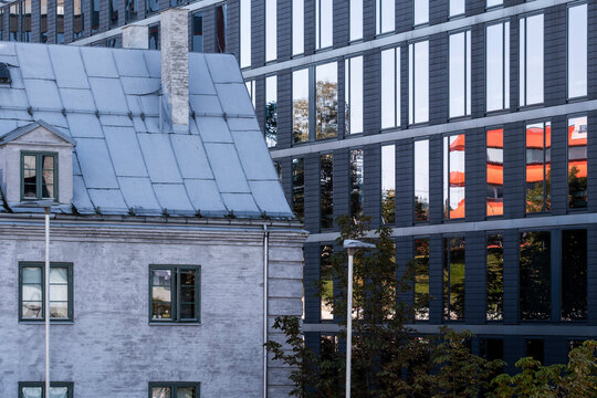Oslo urban cityscape features heritage house facade in contrast with modern office architecture showing mixed use streets and neighborhood character