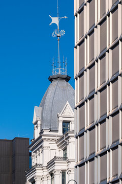 Oslo urban cityscape frames dome spire and facade beside modern office architecture contrast creating distinctive skyline of heritage and business district