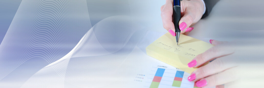 Businesswoman taking notes; panoramic banner