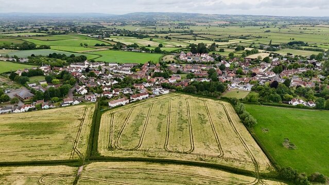 Aerial drone view of North Curry village with wheat fields, Somerset
